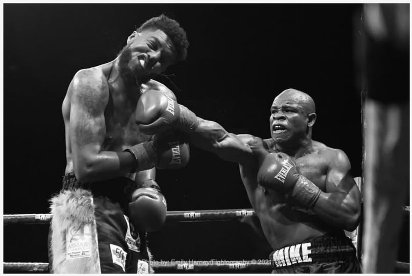 Mike Guy landing a punch during a professional boxing match